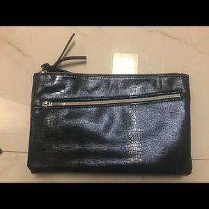 Dark blue clutch with leathery feel